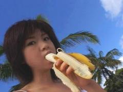 Aki Hoshino Asian Busty Enjoys Banana Next To Palms On Beach