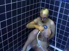 Huge Boobed Slut In Transparent Latex Catsuit Has A Shower And Rubs Her Pussy