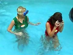 Two Teenage Girls Having Fun Together In The Swimming Pool