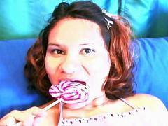 Horny Bitch Licking A Huge Lollipop While Having Her Asian C...