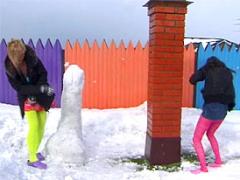 Two Cute Teenage Girls Throwing Snow Balls At Eachother
