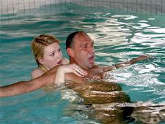 Blonde Teenage Swimming Teacher Helping A Drowned Senior