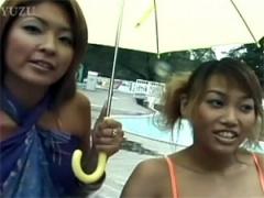 Two Daring Cute Asian Girls In The Public Pool Undressing